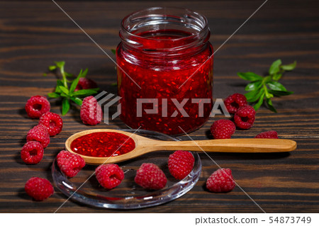Jar of jam and ripe raspberry berries 54873749