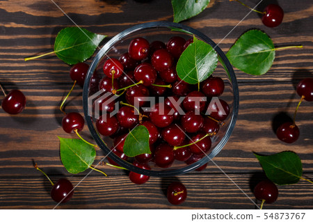 Transparent bowl of ripe cherries Transparent bowl of ripe cherries 54873767