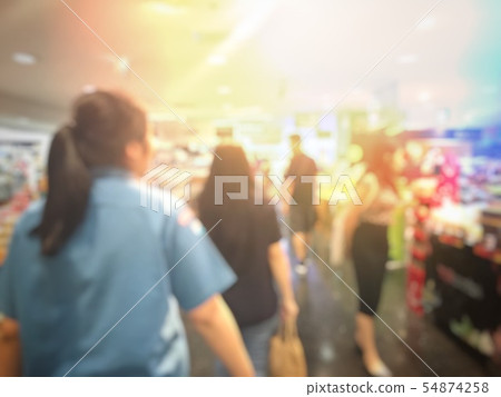 Blurred image of people shopping and walking in 54874258