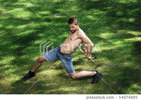 Man dancer of ballet or contemporary dance in park Man dancer of ballet or contemporary dance in park 54874895