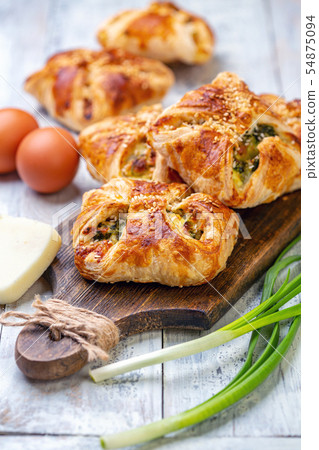 Homemade puffs with spinach, egg and green onions. 54875094