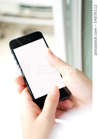 Woman with modern mobile phone in hands touching Woman with modern mobile phone in hands touching 54876112