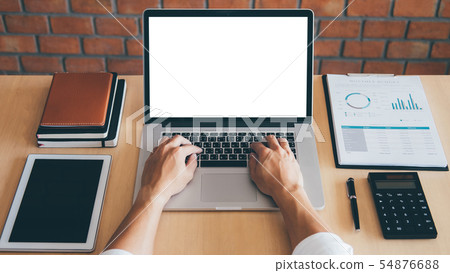 Image of Young man working in front of the laptop 54876688