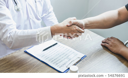 Doctor having shaking hands to congrats with 54876691