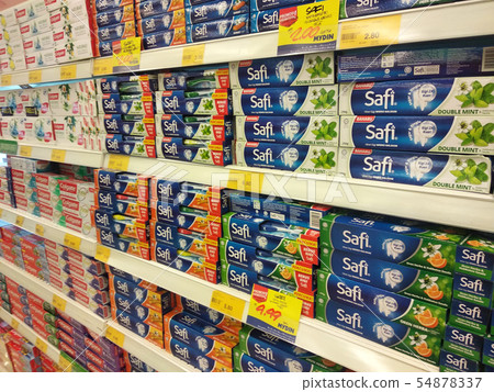 Toothpaste is in the box for sale in supermarket.  54878337