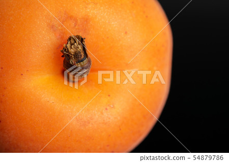Fresh orange apricot isolated on black glass 54879786