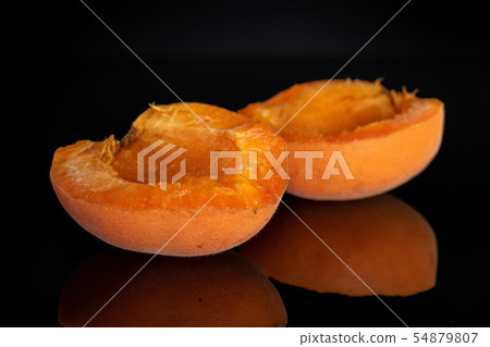 Fresh orange apricot isolated on black glass 54879807