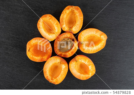 Fresh orange apricot on grey stone 54879828