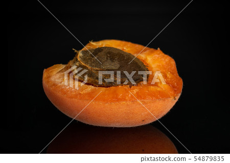 Fresh orange apricot isolated on black glass 54879835