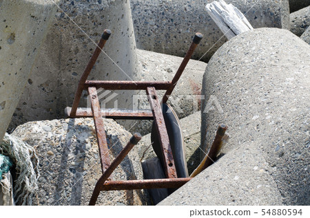Rusted chair on the embankment Rusted chair on the embankment 54880594