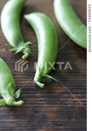 Image photograph of peas taken with natural wood grain background Image photograph of peas taken with natural wood grain background 54880653