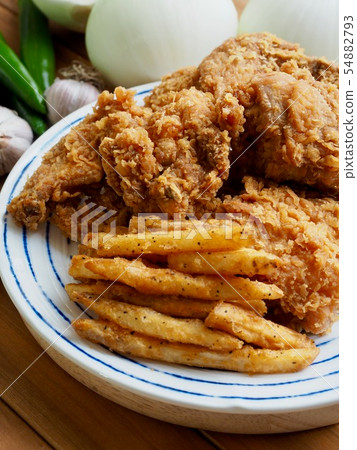 Fried chicken, French fries and vegetables 54882793