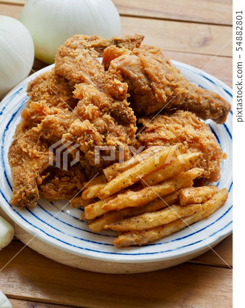 Fried chicken, French fries and vegetables 54882801