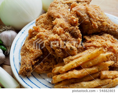 Fried chicken, French fries and vegetables 54882803
