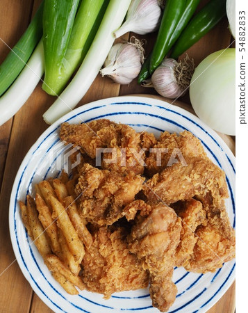 Korean chicken gangjung and fried potatoes 54882833