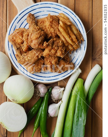 Korean chicken gangjung and fried potatoes 54882835