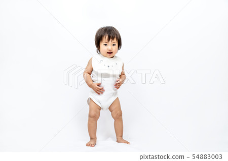 A zero-year-old baby who stands alone. Alone, growth, health, childcare image 54883003