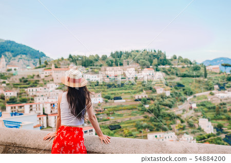 Summer holiday in Italy. Young woman in Positano village on the background, Amalfi Coast, Italy Summer holiday in Italy. Young woman in Positano village on the background, Amalfi Coast, Italy 54884200