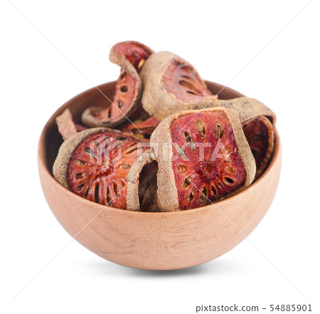 Quince drying in wooden bowl on white background 54885901