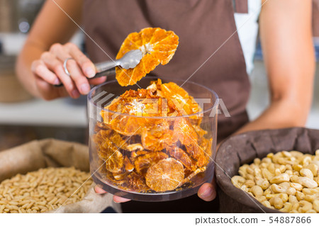Illustration of container with dried orange 54887866