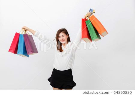 Portrait of beautiful woman holding shopping bags 54890880