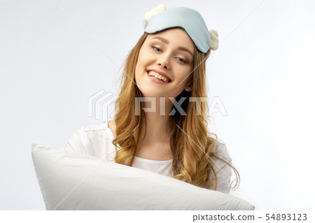 woman in pajamas and sleep mask woman in pajamas and sleep mask 54893123