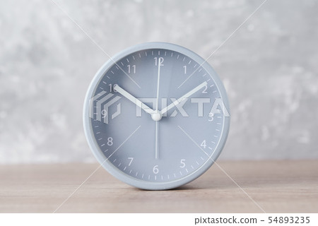 Classic alarm clock on a gray background, close up 54893235