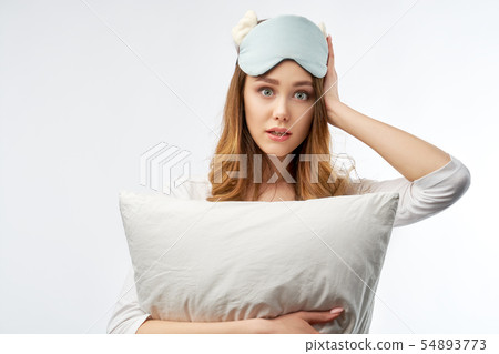 woman in pajamas and sleep mask woman in pajamas and sleep mask 54893773