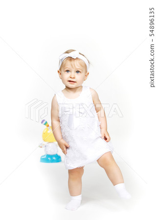 beautiful little girl all in white clothes beautiful little girl all in white clothes 54896135