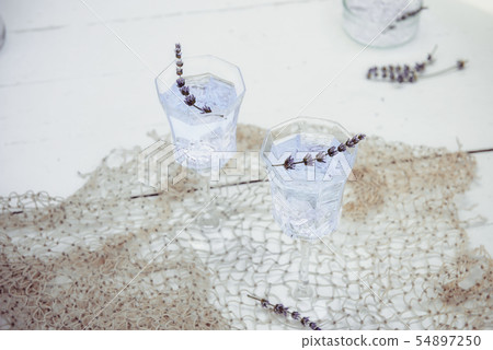 Fresh lavender lemonade with flowers and ice cubes 54897250