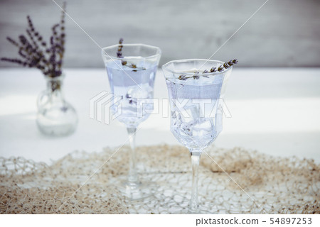 Fresh lavender lemonade with flowers and ice cubes 54897253