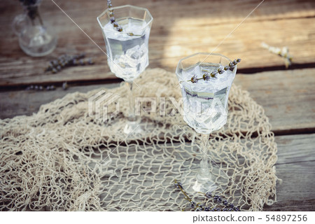 Fresh lavender lemonade with flowers and ice cubes 54897256