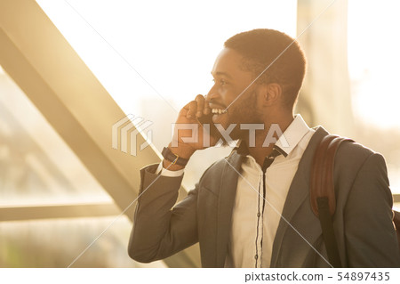 Afro Businessman Having Business Talk, Arriving at Airport Afro Businessman Having Business Talk, Arriving at Airport 54897435