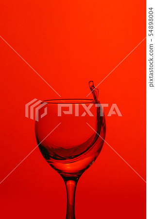 splash of water in wineglass splash of water in wineglass 54898004