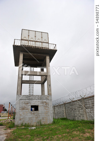 Water tank towers and barbed wire 54898771