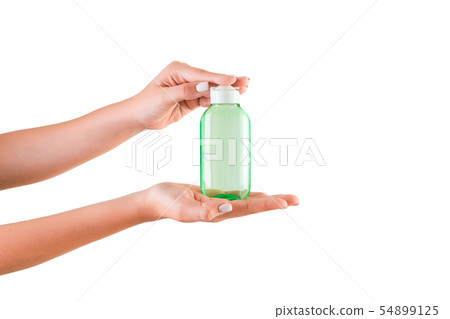 Female hand holding cream bottle of lotion Female hand holding cream bottle of lotion 54899125