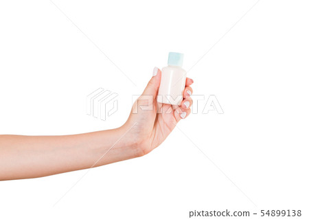 Female hand holding cream bottle of lotion Female hand holding cream bottle of lotion 54899138