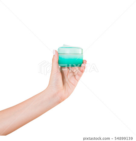 Female hand holding cream bottle of lotion 54899139