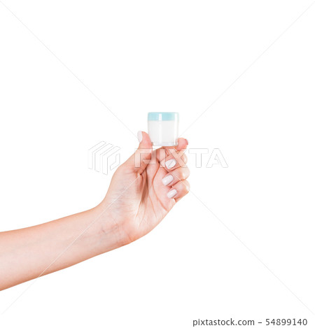 Female hand holding cream bottle of lotion Female hand holding cream bottle of lotion 54899140