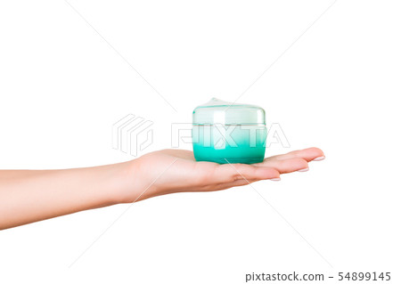 Female hand holding cream bottle of lotion 54899145