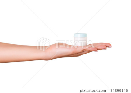 Female hand holding cream bottle of lotion 54899146