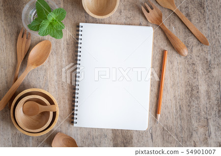 Blank notebook for text note on wooden table Blank notebook for text note on wooden table 54901007