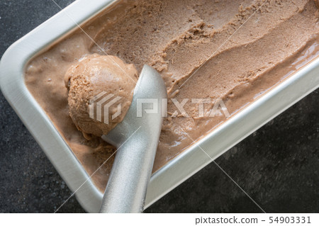 Homemade banana and chocolate ice cream in metallic container. Close up. Top view. Homemade banana and chocolate ice cream in metallic container. Close up. Top view. 54903331