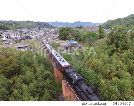 SL crossing the Arakawa bridge "Pareo Express" ~ Aerial photograph with drone (Nagami Town of Chichibu-cho, Chichibu-gun, Saitama Prefecture · Shinodano-cho Shimodano) 54904167