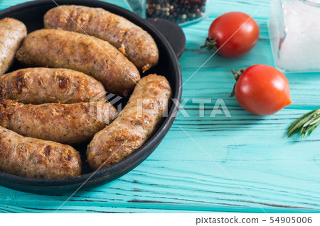 Grilled sausages with tomatoes , pepper and 54905006
