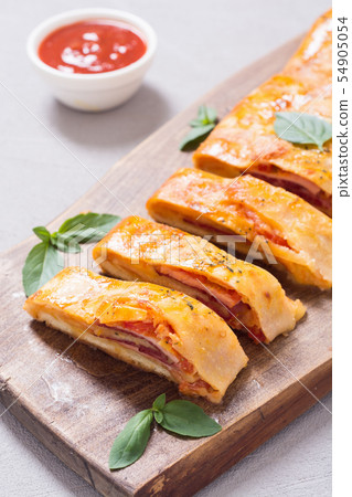 Pizza roll stromboli with cheese salami olives and 54905054