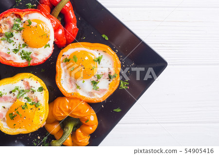 Baked pepper stuffed with bacon and eggs 54905416