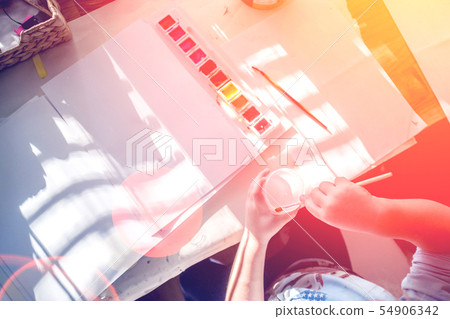 boy is having fun while playing with stamps and boy is having fun while playing with stamps and 54906342