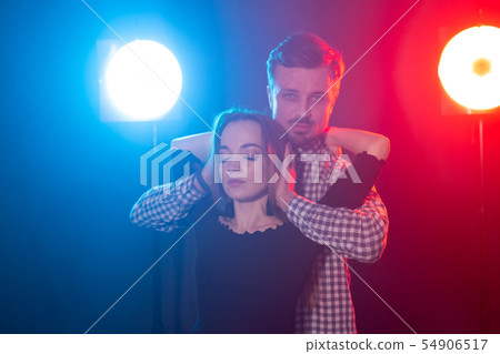 Social dance, bachata, salsa, kizomba, zouk, tango concept - Man hugs woman while dancing over Social dance, bachata, salsa, kizomba, zouk, tango concept - Man hugs woman while dancing over 54906517