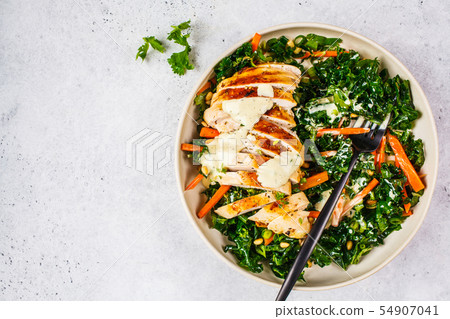 Grilled chicken breast salad with kale, pine nuts 54907041